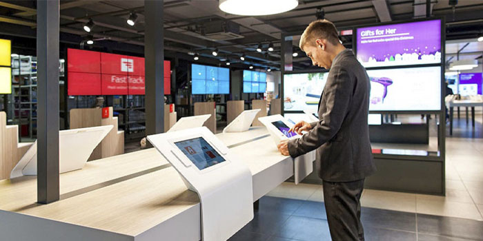 man looking at a tablet display